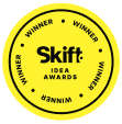 Yellow circular badge with ‘Skift IDEA AWARDS’ in the center and ‘WINNER’ repeated around the edge, recognizing excellence in tourism marketing